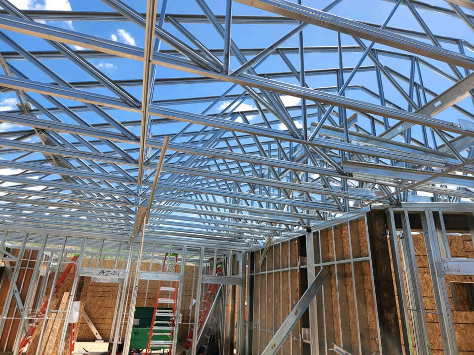 Steel roof trusses and interior wall framing in a multifamily apartment building